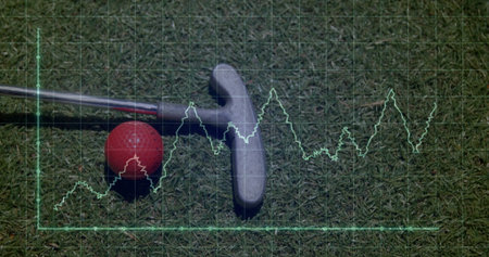 Featuring putter head and shaft resting beside red golf ball on putting green with glowing waveform. Sports equipment, outdoor recreation, minimalist design, athletic gear, wellness, precision, concentrationの写真素材