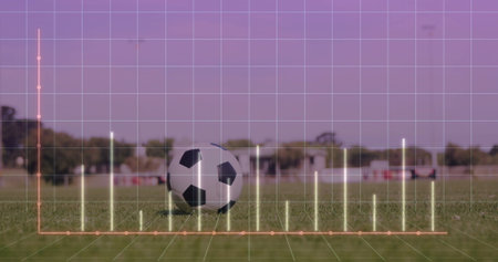 Displaying soccer ball resting on grass pitch, with 3D grid overlay, bar chart, orange line graph. Athletic, data, analytics, outdoor, technology, performance, competitiveの写真素材