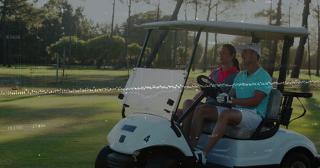 Driving man wearing golf glove steering electric golf cart on fairway, with woman in pink polo. Luxury, leisure, outdoor, recreation, refined, lifestyle, tranquilityの写真素材