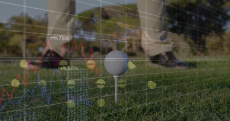 Standing golfer in golf attire next to ball on tee box, with financial data overlay. Sports, analytics, performance, outdoor, modern, visualization, leisureの写真素材