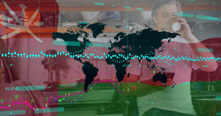 Drinking adult man sipping coffee mug, viewing Oman flag and market graphs in kitchen, copy space. Corporate, analytics, modern, business, professionalism, technology, data visualizationの写真素材