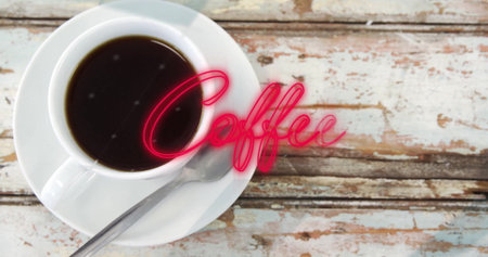 Showing white porcelain coffee cup resting on cafe countertop, with neon Coffee script, copy space. Rustic, minimalist, vintage, cozy, artistic, vibrant, beverageの写真素材