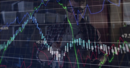 Man wearing plaid shirt analyzing market charts in office, with candlestick overlay and +6.31%....