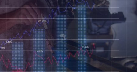 Technician adjusting drill press handle and overlaying performance charts in workshop, copy space. Industrial, manufacturing, analytics, engineering, precision, productivity, data visualizationの写真素材