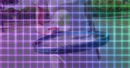 Woman in white attire serving on tennis court, with racket, ball, wristband, neon grid overlay. Athletic, sport, competition, modern, digital, energetic, activewearの写真素材