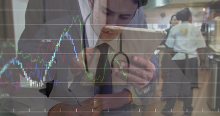 Reviewing tablet doctor in lab coat, stethoscope in kitchen with chefs showing overlaid line graphs....