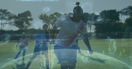 Dribbling African American woman in red jersey guiding soccer ball on field with digital graphics....