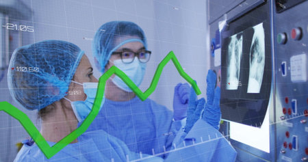 Male and female surgeons wearing scrubs studying X-ray scans in surgical suite, with data overlay....