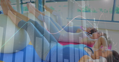 Crunching ab muscles, three women lying on stability balls in fitness studio. Fitness, wellness,...