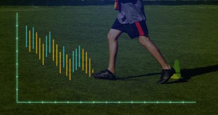 Running man wearing gray top and shorts on turf with green cone and virtual chart overlay. Athletic,...