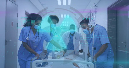 Pushing patient on stretcher through hospital corridor with surgical masks, IV drip, hazard icon....