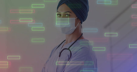 Standing clinician wearing mask, turban, scrubs and stethoscope in clinic hallway with overlays....