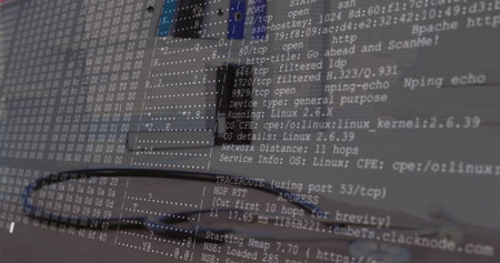 Displaying Nmap port scan overlay on screen at workstation, with laptop keyboard and network cable....