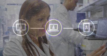 Interacting female researcher in lab coat touching interface in tech lab, with network overlay....