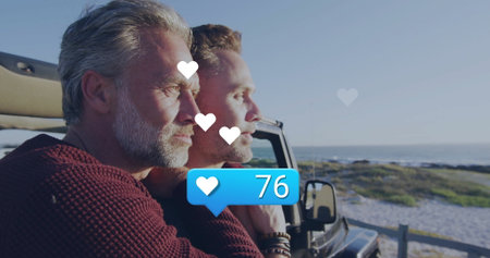 Leaning men gazing at ocean in convertible at overlook, overlay of 76 heart icons, copy space....
