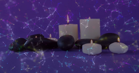 Displaying arrangement of pillar candles and black stones on purple table with network overlay. Zen,...
