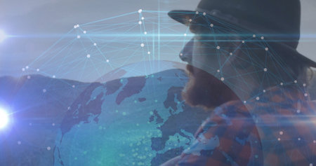 Projecting silhouette man wearing fedora plaid shirt on network globe and lens flares, copy space....