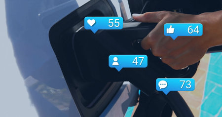 Connecting black EV charger into white car port at poolside patio, with blue social icons....