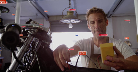 Testing motorcycle frame wiring, mechanic applying yellow multimeter probes in garage workshop. Mechanic, workshop, industrial, engineering, tools, troubleshooting, vintageの写真素材