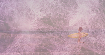 Wading surfer wearing bikini holding yellow surfboard amid pink light trails at beach, copy space....