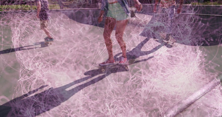 Balancing female skateboarder in green shorts in skatepark bowl, with smartphone and chalk dust. Sports, recreation, urban, dynamic, youthful, adventure, fitnessの写真素材
