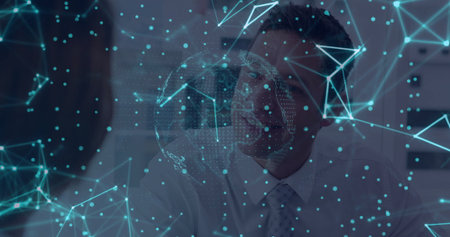 Businessman wearing tie interacting with holographic network map in office, with digital globe....
