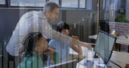 Pointing senior staff in checkered shirt guiding team at open-plan desk with monitor, copy space....