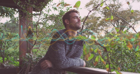 Leaning adult man gazing sideways on outdoor wooden porch railing, with audio waveform overlay....