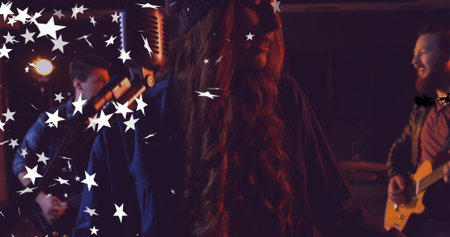 Singing female vocalist wearing knit cap, dark coat on stage, with vintage mic, star graphics....