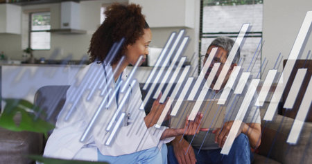 Reviewing patient data, medical professional in scrubs swiping tablet on sofa at home data overlay....