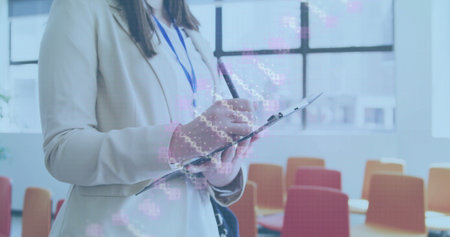 Woman wearing blazer with badge writing on clipboard in conference room, with pen, copy space....