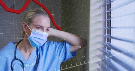 Leaning female nurse in scrubs gazing through clinic window blinds, stethoscope overlay, copy space. Medical, healthcare, professional, hospital, diagnostic, data, technologyの写真素材