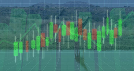 Standing adult elephant raising trunk at riverside channel with green red candlestick bars and grid....