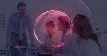 Displaying red translucent 3D globe overlay above conference room table, with laptop documents....