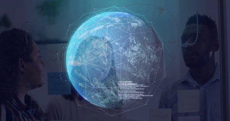 Collaborating data analysts analyzing holographic Earth projection at glass board in modern office....