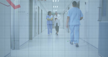 Walking nurse in scrubs and doctor discussing data on tablet and folder in hospital corridor. Medical, healthcare, clinical, professional, diagnostic, hospital, teamworkの写真素材