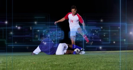 Highlighting soccer players in kits controlling ball and sliding tackle on night grass, neon grid. Athletics, competition, technology, digital, sportswear, futuristic, energyの写真素材