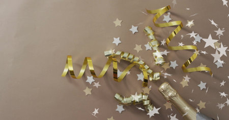 Gold ribbons and stars with champagne bottle, celebration image. festive, party, luxury, sparkle,...