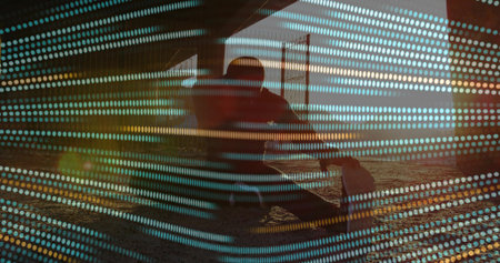 Crouching skateboarder beneath wooden pier columns on sandy seabed with teal gold dot overlay. Skateboard, beach, urban, minimalist, adventure, outdoor, resilienceの写真素材