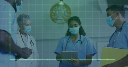 Healthcare team reviewing grid data in consultation room, with tablet, file folder and stethoscopes. Medical, collaboration, clinical, analysis, healthcare, diagnostic, teamworkの写真素材