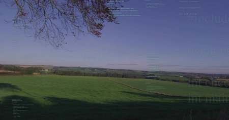 Showcasing green pasture spanning rolling farmland hills with farmhouses, hedgerows and tree branch. Rural, landscape, nature, tranquility, outdoors, scenic, agriculturalの写真素材