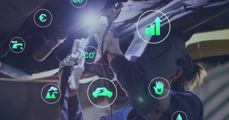 Operating gloved technician grinding chassis with grinder at workshop. Mechanic, industrial, technological, innovation, safety, repair, machineryの写真素材