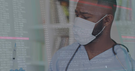 Doctor in scrubs with mask holding pen scanning code overlay on screen in office, with stethoscope. Medical, professional, technology, healthcare, innovation, clinical, diagnosticsの写真素材