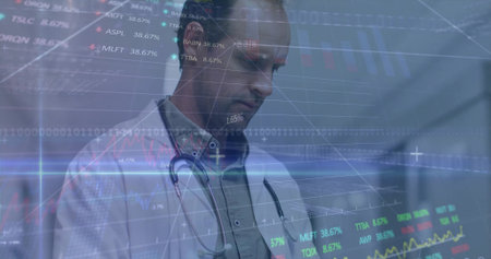 Doctor wearing lab coat and stethoscope viewing stock tickers on hologram in hospital corridor....