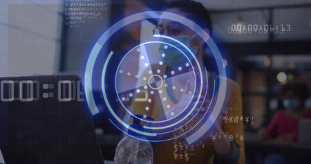 Viewing charts on laptop and phone, analyst wearing cardigan, surgical mask at office AR overlay. Technology, data visualization, professional, modern, digital, workspace, analysisの写真素材