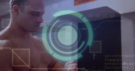 Shirtless boxer wrapping white hand wraps in gym, with hologram, wall pads, orange sign, copy space. Fitness, athlete, technology, training, sport, determination, strengthの写真素材