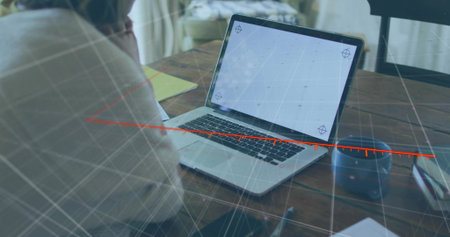 Working woman analyzing data on laptop at office, with coffee mug smartphone, overlay, copy space. Productivity, technology, digital, workspace, professionalism, innovation, modernの写真素材