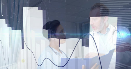 Doctor wearing stethoscope examining digital chart overlays in exam room, nurse holding file folder. Medical, healthcare, technology, professional, analysis, diagnostic, clinicalの写真素材