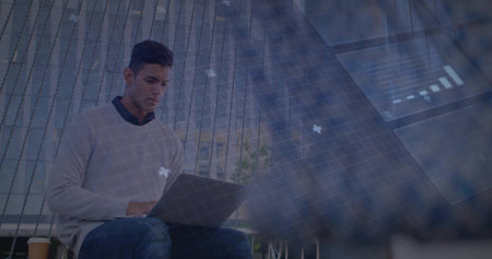 Working Hispanic man wearing sweater on bench seat in modern lounge, with laptop, coffee cup, plant....