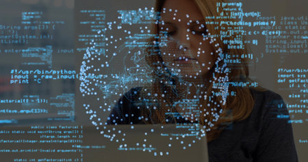 Working software developer coding on laptop in workspace, with blue code data visualization network. Technology, innovation, digital, futuristic, programming, cybersecurity, data analysisの写真素材